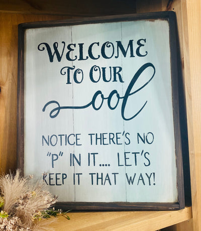 Hand painted wood sign reads Welcome to our ool. Notice there’s no P in it… let’s keep it that way!