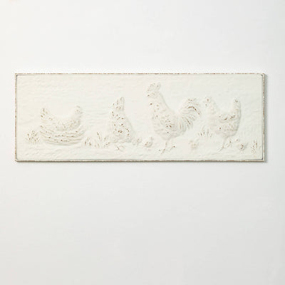 White metal wall art with chicken designs