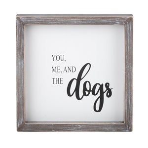 Framed white sign reads You, Me, And the dogs