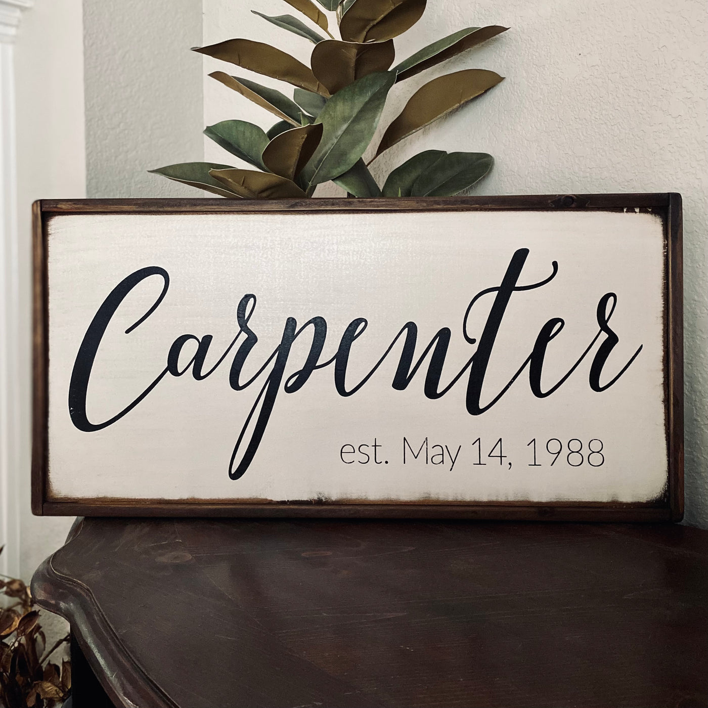 Handmade personalized wood sign reads family name Carpenter and established date “est. May 14, 1988”
