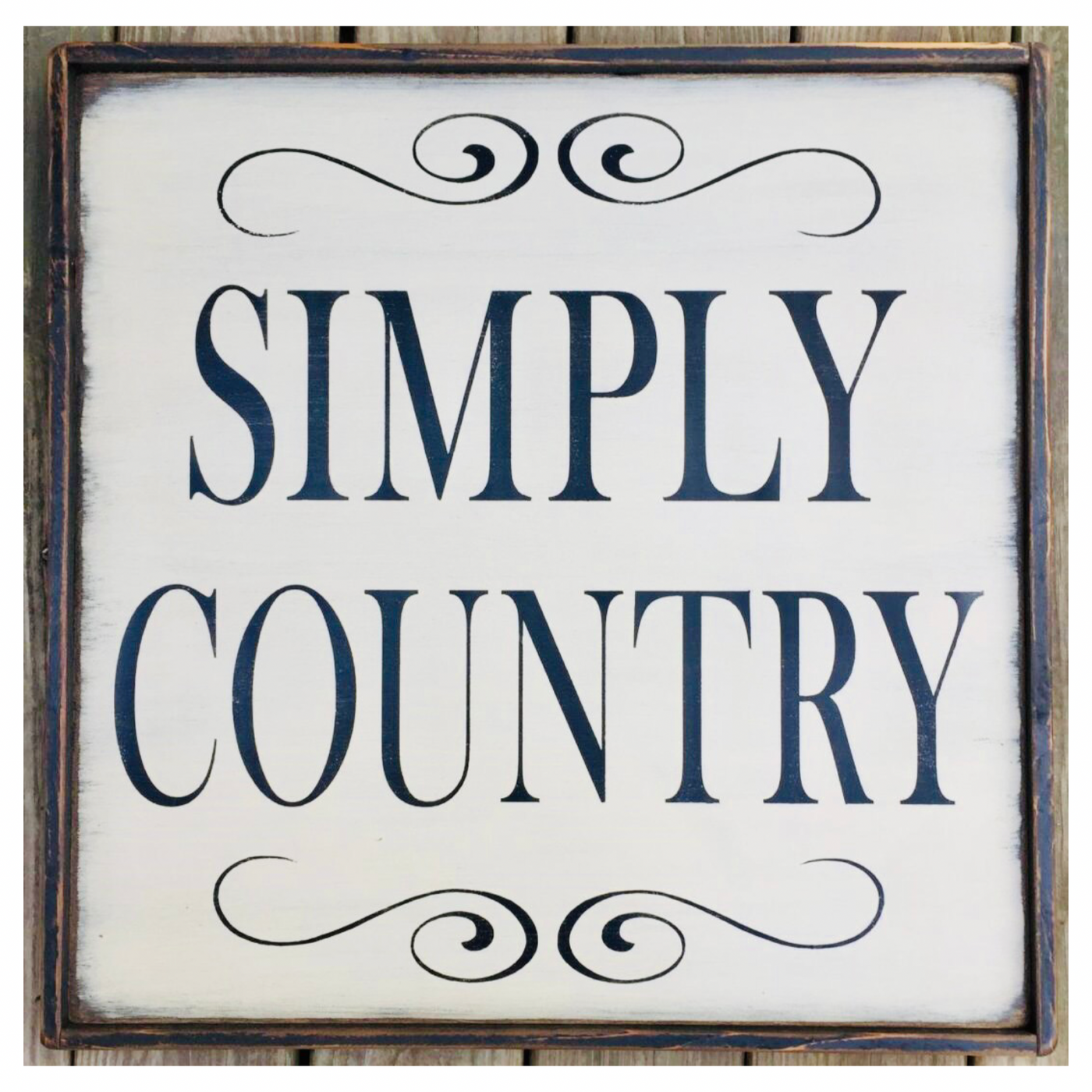 Handmade wood sign reads Simply Country