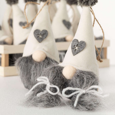 Cute gnome ornaments with a cream hat with a grey beard or grey pigtails