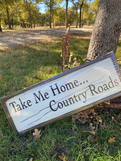 Handmade wood sign reads Take Me Home Country Roads