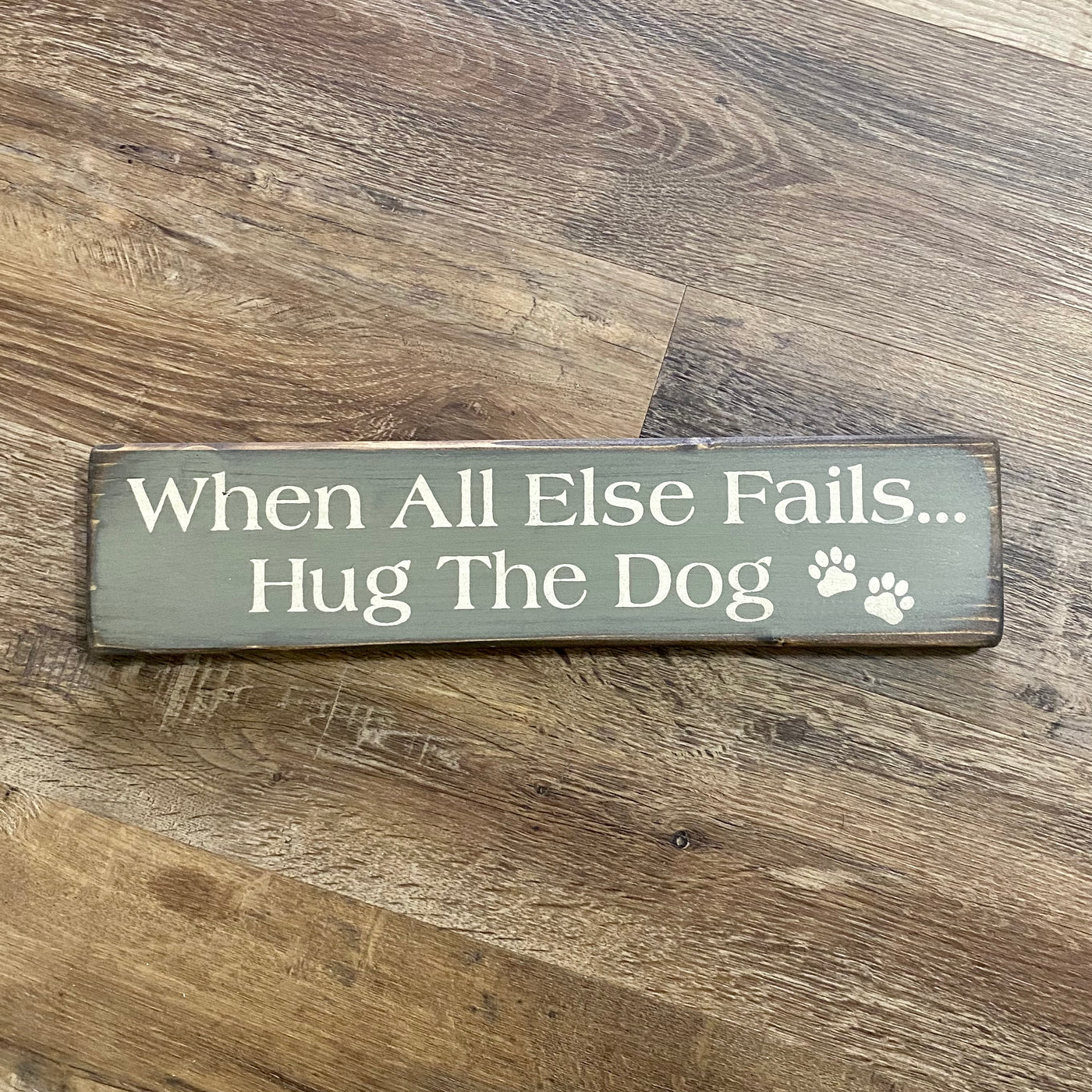 Handmade wood sign reads When All Else Fails Hug The Dog with Paw print accents