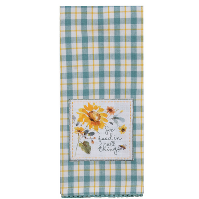 Teal and yellow  plaid towel with sunflowers and embroidered detail that reads see good in all things