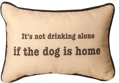 White pillow with black lettering reads it’s not drinking alone if the dog is home. Black has black and white stripes