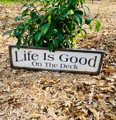 Handmade wood sign reads Life Is Good On The Deck