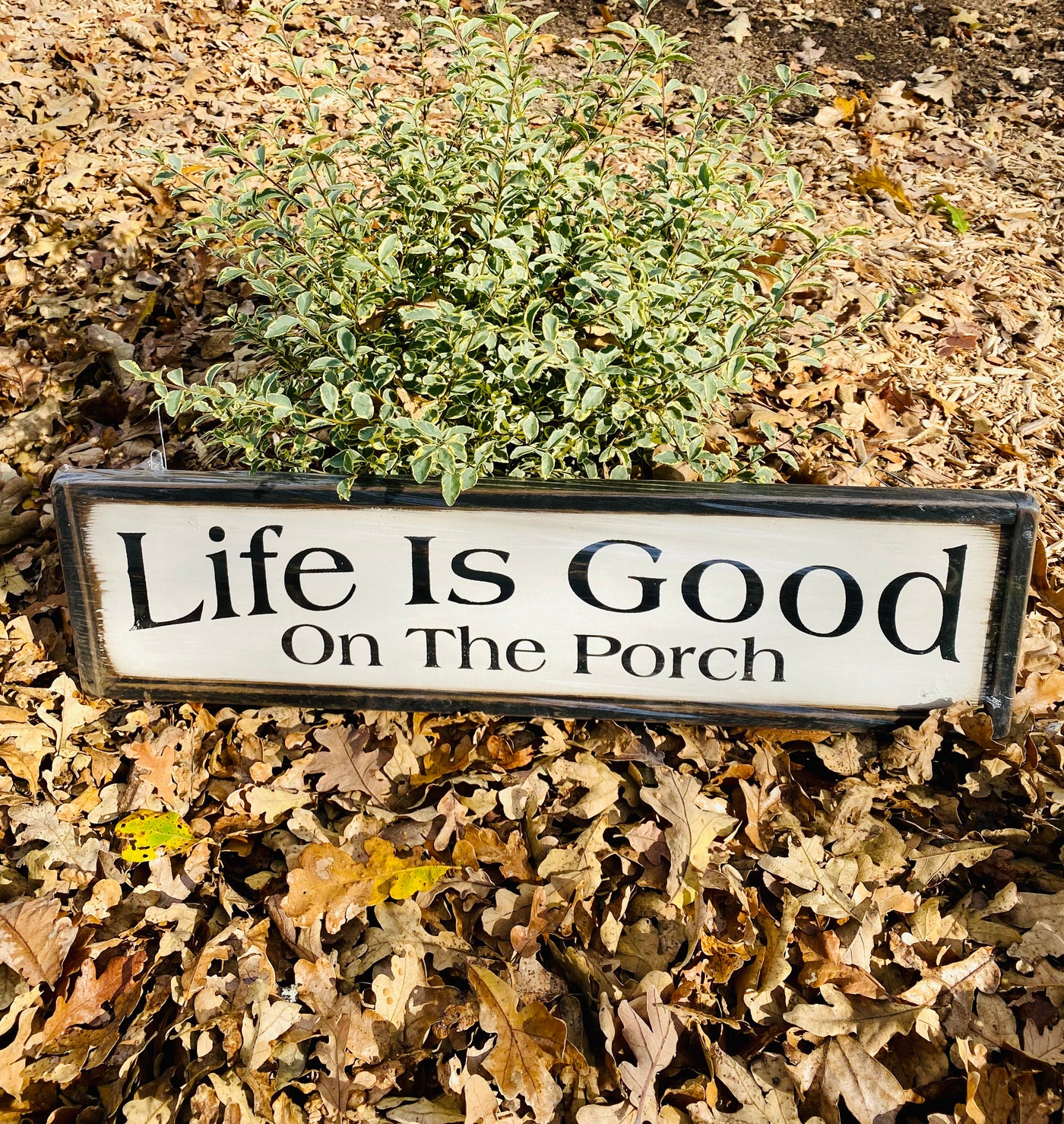 Handmade wooden sign reads Life Is Good On The Porch