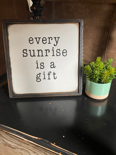 Handmade wood sign reads Every sunrise is a gift