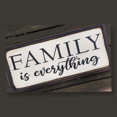 Handmade wood sign reads Family is Everything 