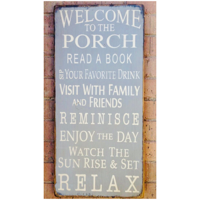 Solid wood porch sign reads Welcome To The Porch, Read a Book, Sip Your Favorite Drink, Visit with Family and Friends, Reminisce, Enjoy the Day, Watch the Sun Rise & Set, RELAX