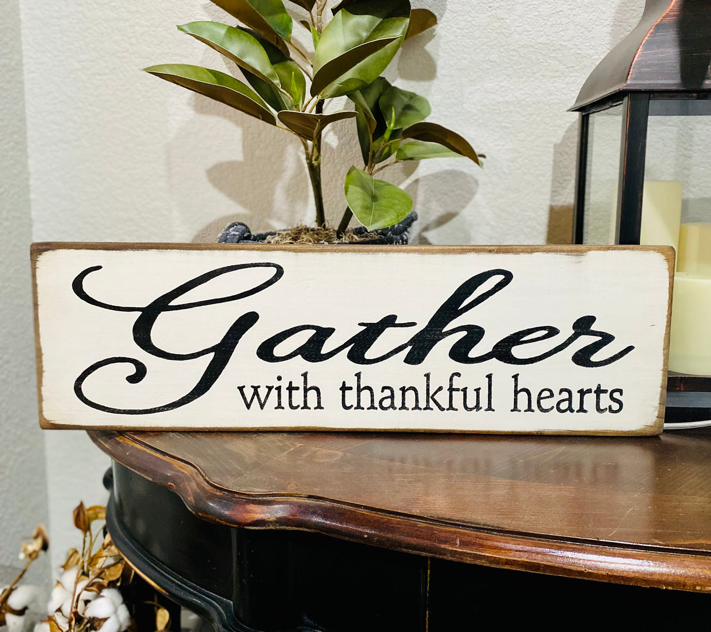 White sign black lettering reads Gather with thankful hearts 