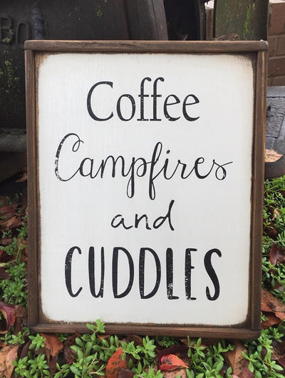 Handmade wood sign reads Coffee Campfires and Cuddles