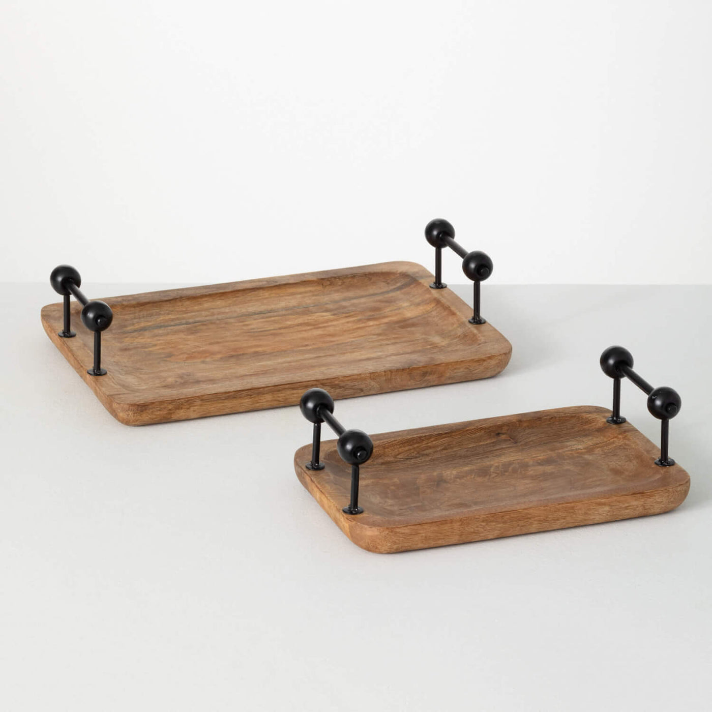 Two rustic rubber wood trays with black metal handles