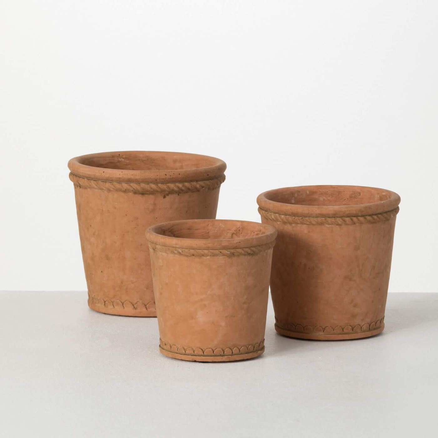 Terracotta style rustic clay colored planter pots  with detailed rope textures