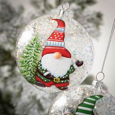 Glittery glass ornaments with painted festive christmas gnome scene