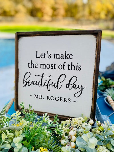hand painted wood sign with Mr. Rogers quote reads let's make the most of this beautiful day. Mr. Rogers. 