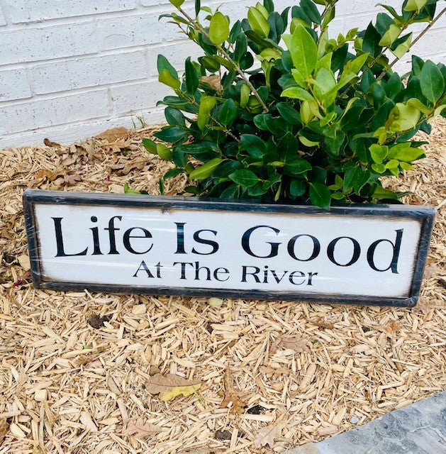 Handmade wood sign read Life Is Good At The River
