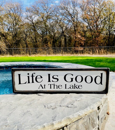 Handmade wood sign reads Life Is Good At The Lake