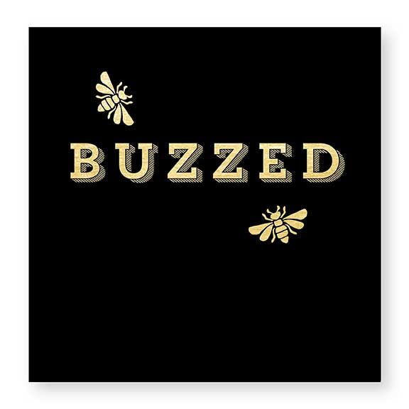 black and gold beverage napkin reads "BUZZED" with golden bee accents