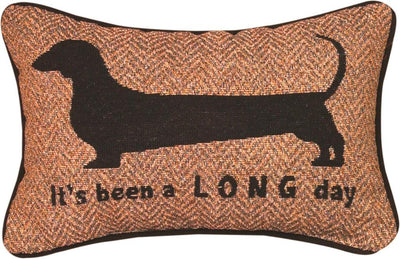brown throw pillow with black outline of a dachshund reads It's been a long day. 
