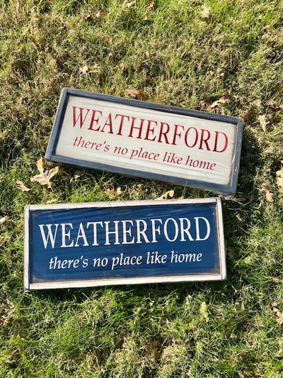 Handmade wood signs read Weatherford there’s no place like home
