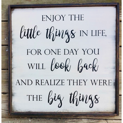 Handmade wood sign reads Enjjoy the little things in life, for one day you will look back and realize they were the big things